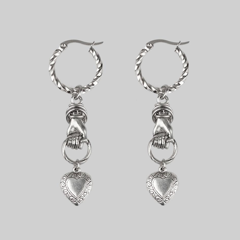 ALL OF ME. Hand Grasping Heart Earrings - Silver - Image 3