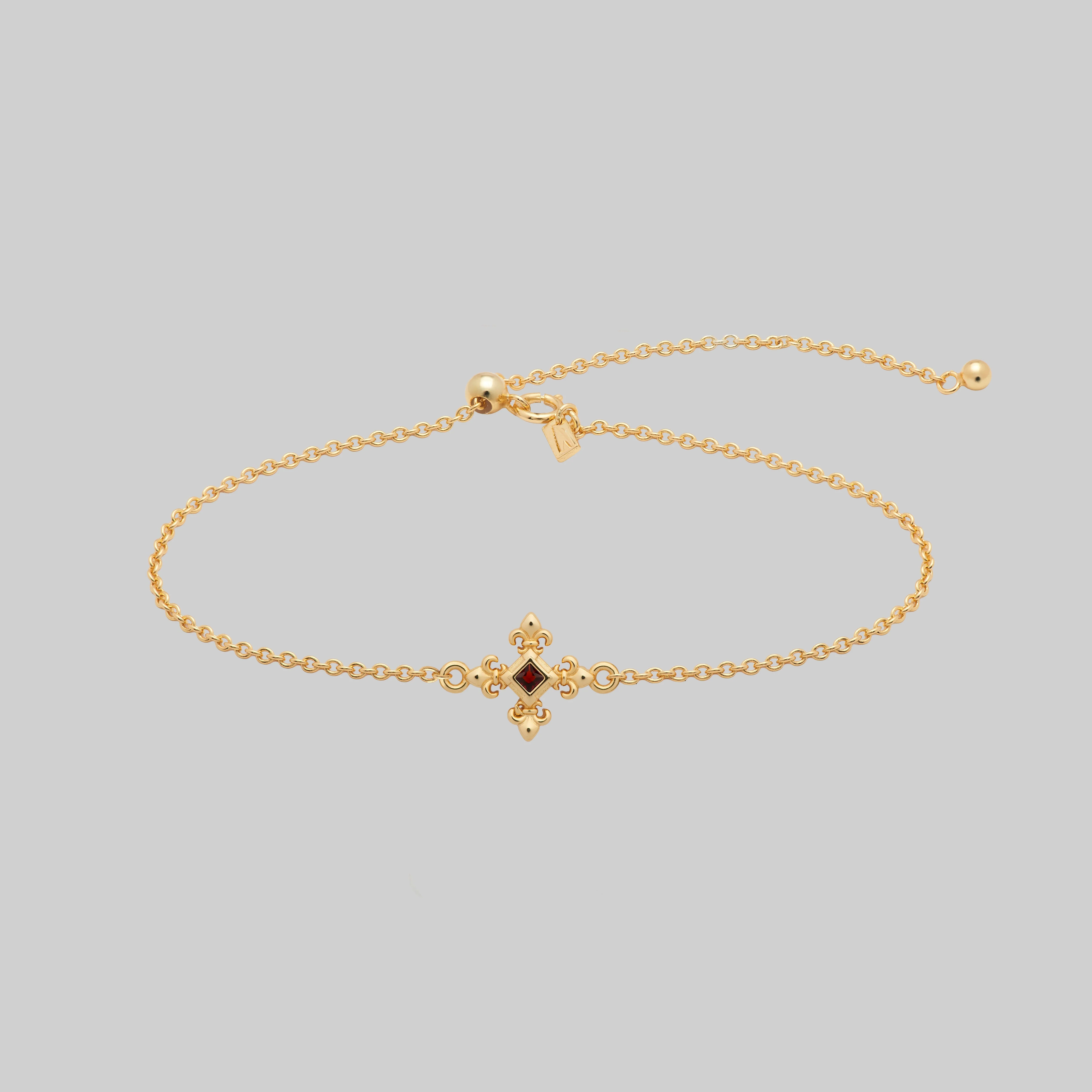CRIMSON. Fleur de Lis Garnet Bracelet - Gold
